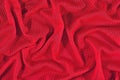 Red crumpled nonwoven fabric background Royalty Free Stock Photo