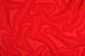 Red crumpled nonwoven fabric on a yellow Royalty Free Stock Photo