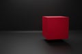 Red cube on black color background stage for product promotion. Minimalist design, modern platform
