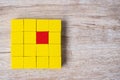 Red cube block different from crowd of yellow blocks. Unique Leader, strategy, independence, think different, business and success