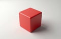 Red cube shape centered on white background. Simple geometric form isolated object with smooth surface. Clear visual element, Royalty Free Stock Photo