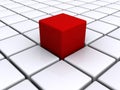 Red cube on white grid