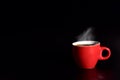 Red cup coffee on black background for love concept, relax concept, drinking concept for advertisement, selective focus on cup Royalty Free Stock Photo