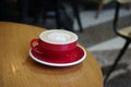Red cup coffee. Cappuccino, Cappucino in Coffee House served on table Royalty Free Stock Photo