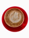 red cup of coffee isolated on white background, latte art in heart shape, milk foam vertical Royalty Free Stock Photo