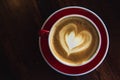 The red cup coffee love , coffee dark in wood dark table Royalty Free Stock Photo