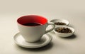 red cup with coffee on a white background close-up and two bowls with coffee beans next to it Royalty Free Stock Photo