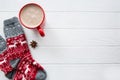 Red cup of hot cacao and Christmas sock with ornament and deer. Royalty Free Stock Photo