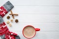 Red cup of hot cacao and Christmas sock with ornament and deer. Royalty Free Stock Photo