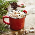 Red cup of hot chocolate with marshmallow on windowsill. Weekend concept. Home style. Christmas time. Royalty Free Stock Photo