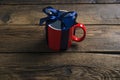 Red cup mug with blue ribbon bow gift Royalty Free Stock Photo