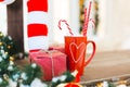 Red cup of tea or coffee or hot chokolate with sweets and gift - Christmas Holiday Background Royalty Free Stock Photo