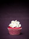 Red cupcake purple background Royalty Free Stock Photo