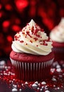 a red cupcake with white frosting and sprinkles Royalty Free Stock Photo