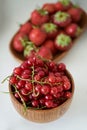 Red currant berry in a wooden bowl, close-up. Fresh currant fruit Royalty Free Stock Photo