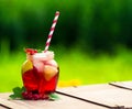 Red currant drink on wooden table