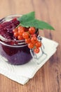 Red currant jam and ripe on wooden table Royalty Free Stock Photo