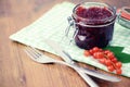 Red currant jam and ripe on wooden table Royalty Free Stock Photo