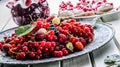 Red currant sponge cake. Plate with Assorted summer berries, raspberries, strawberries, cherries, currants, gooseberries.