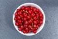 Red currants berries from above bowl slate Royalty Free Stock Photo