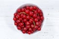 Red currants berries from above bowl wooden board Royalty Free Stock Photo