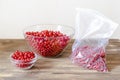 Red currants in bowl prepare for frozing in package at home kitchen for winter.peeling summer fruits Royalty Free Stock Photo