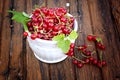 Red currants white ceramic bowl old wooden background rustic style Royalty Free Stock Photo