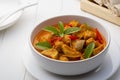 Red curry with clown featherback fishball in white bowl Royalty Free Stock Photo