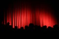 Red curtain with audience