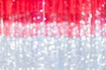 Red curtain and light bokeh blur background. Blurred backdrop. Christmas background. Holiday winter theme