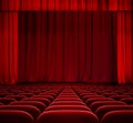 Red curtain on theater stage with red velvet seats Royalty Free Stock Photo