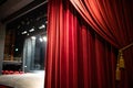 Red curtain on theatre or cinema stage slightly open Royalty Free Stock Photo