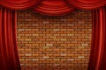 Red curtains on brick wall background. Royalty Free Stock Photo