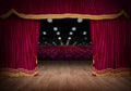 The red curtains are opening for the theater show Royalty Free Stock Photo