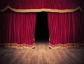 The red curtains are opening for the theater show Royalty Free Stock Photo