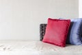 red cushions on a white fabric long sofa in a modern home living room Royalty Free Stock Photo