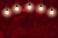 red nice sparkling glitter lights defocused bokeh abstract background with light bulbs and falling snow flakes fly, festival Royalty Free Stock Photo