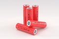 5 red cylindrical lithium-ion batteries type 18650 on a light gray background. Rechargeable batteries for electrical