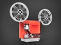 Red 3d cinema film projector isolated on gray background. 3d rendering. Royalty Free Stock Photo