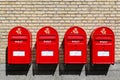 Red danish letterboxes on a wall