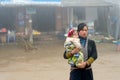 Red Dao woman with child in Sapa, Vietnam