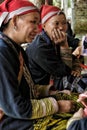 Red Dao women sewing in the village.