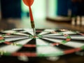 Red dart arrow hit in the target center of dartboard, winner concept, goal concept Royalty Free Stock Photo