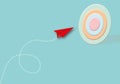 Red dart arrow hitting in the pastel target centre on blue background, Business target or goal success. Royalty Free Stock Photo