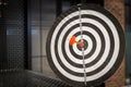 Red dart arrow hitting in the target center of dartboard on bullseye Royalty Free Stock Photo