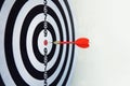 Red dart on board right direction hit target goal. Competition game to win focus on achievement with smart thinking planning Royalty Free Stock Photo