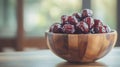 Red Dates in Wooden Bowl on Wooden Table Royalty Free Stock Photo