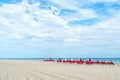 Red deck chairs, umbrellas on coast, South Beach, Miami, Florida Royalty Free Stock Photo