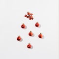 Red decoracion balls with shadow on white background. Top view. Flat lay Royalty Free Stock Photo