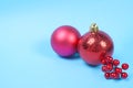 Red decoration baubles on blue background Royalty Free Stock Photo